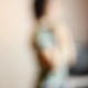 Habib Rezaei, a blurry Photograph of a standing female with a blue pants